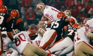 Joe Montana leaps for a touchdown.