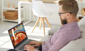 Young gambler playing online roullette