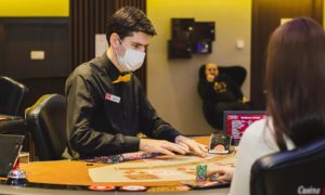 masked dealer at casino