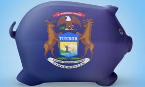 A piggy bank with the Michigan flag