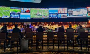 Fans watching games at a bar
