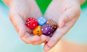 Dice in the hands of a kid