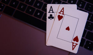 Online,Gambling,Theme.,Aces,On,A,Laptop's,Keyboard.,Top,View