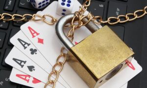Stop,Online,Gambling,Concept,With,Padlock,,Playing,Cards,And,Laptop