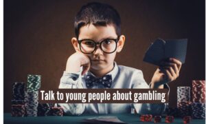 kid playing poker, advice on discussing gambling with youth in Michigan