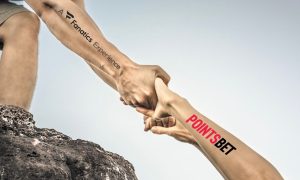 Image of people helping each other climb for story on Fanatics helping PointsBet climb the Michigan online casino sector