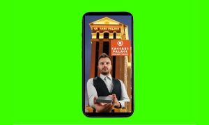Image of Caesars Palace hybrid dealer game on phone in front of green screen for story on Caesars Casino Michigan adding hybrid dealer games via Inspired Entertainment