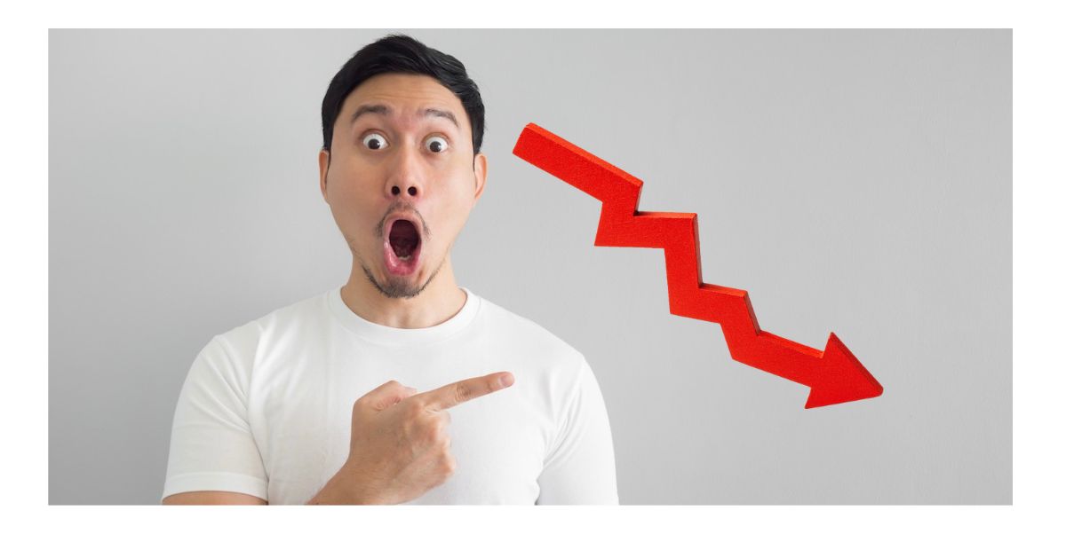 Image of shocked man pointing at downward arrow for story on Detroit casino revenue for October being hurt by the workers' strike