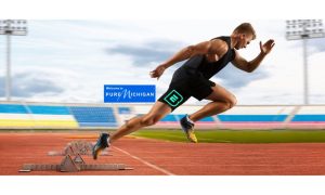 Sprinter wearing the ESPN BET logo on his shorts as he is coming out of the starting blocks at a stadium in Michigan to signify ESPN BET's strong start in Michigan