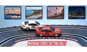 Two slot cars racing into a turn. The lead car is labelled 2022, the other is labelled 2023. There are four posters of iconic Michigan scenes on the wall. The race represents the fact that 2023 Michigan online sports betting handle could surpass 2022's handle.