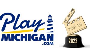 A top 10 2023 trophy next to the PlayMichigan logo