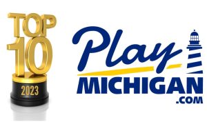 A top 10 2023 trophy to the left of the PlayMichigan logo
