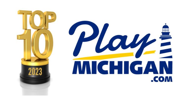 A top 10 2023 trophy to the left of the PlayMichigan logo