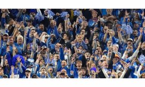 Detroit Lions fans celebrating. Michigan online sports betting set record in December and for 2023