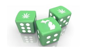 Image of three green dice on a white background. Two of the dice have a cannabis leaf on the side facing up, the other has an outline of Michigan on the side facing up to show how Michigan's cannabis industry was comparable in tax revenue to online gambling in 2023