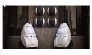 Photos of two Knightscope K5 and four K1 Hemispheres robots.
