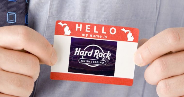 Business man with a "Hello my name is" sticker with the Hard Rock online casino logo on it. Hard Rock online casino and sportsbook has two ways it could come to Michigan: by acquiring BetRivers or the open license left by SI.