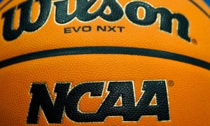 Close-up of a Wilson official NCAA basketball. NCAA President Charlie Baker is calling on lawmakers in states like Michigan to ban prop bets on college sports.