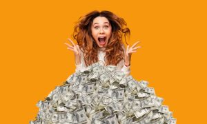 Excited woman is popping out of the top of a mile of money. A series of hourly draws on Saturday evenings this month will determine which four guests get to spin the Millionaire Maker Wheel.