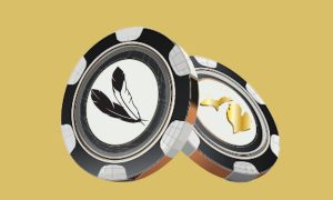 Two large black and white casino chips - one features a tribal feather logo and the other features the outline of the state of Michigan. Michigan tribal casinos display a 1.4% decrease in gaming payments, according to a report released by the MGCB.