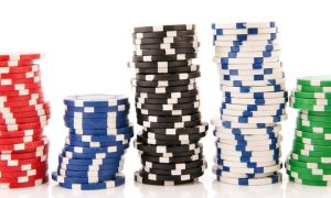 Stacks of casino chips against a white background. Over the last five years, Michigan's 26 casinos have had combined revenue of some $13.2 billion. PlayMichigan provides a complete breakdown.