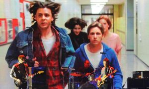 Scene from The Breakfast Club movie plays behind the band Death Cab For Cutie during a tribute to director John Huges at the 2010 Critics Choice Awards. A Michigan Lottery Club, known as "The Breakfast Club," won a Powerball jackpot on Jan. 1 worth more than $842 million.