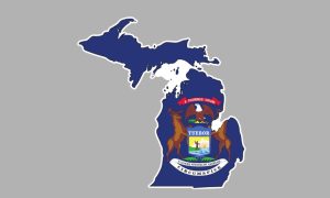 State of Michigan outline with the Michigan state flag on it. The MGCB's campaign against illegal gambling has been called threatening. However, it stands by its job to protect Michiganders.