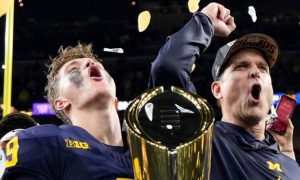 JJ McCarthy and Jim Harbaugh of the Michigan Wolverines football team celebrate a victory in the national championship game. College prop betting in Michigan is still allowed, as the MGCB is "collecting feedback" as football season kicks off in exactly one month.