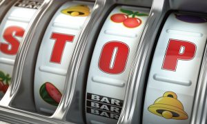 The letters "STOP" appear on a slot machine reel. Following a PlayMichigan story, the MGCB has published a press release refuting claims about its handling of illegal gambling in Michigan.
