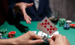 Poker play throws his cards on the table as he folds. The MotorCity Casino will close its poker room in three weeks. Poker rooms remain open at the other two Detroit casinos.