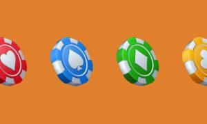 Four poker chips with the four playing card suits on them. Michigan is the first market where DraftKings' Electric Poker product is available. It can be found in DraftKings' online casino platform.