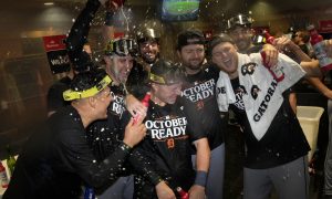 The Tigers celebrating in their clubhouse after defeating the Astros in the Wild Card round of the 2024 MLB Playoffs