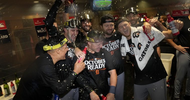 The Tigers celebrating in their clubhouse after defeating the Astros in the Wild Card round of the 2024 MLB Playoffs