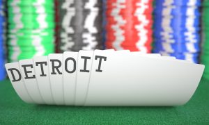 a hand of cards that spells out Detroit