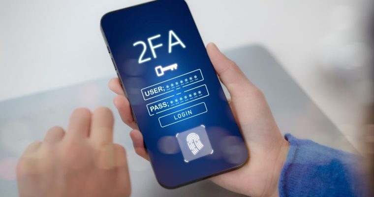 a mobile phone with a two-factor authentication notice appearing on it.