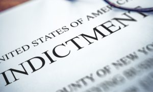 a close up of an indictment document