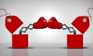 a pair of boxing gloves that are popping out of boxes colliding
