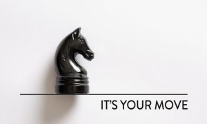 a horse chess piece sitting atop a line that reads its your move beneath it