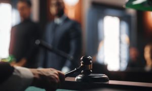 a judge hammering down a gavel in the court room