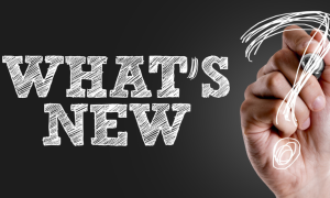 What's New? written on glass panel