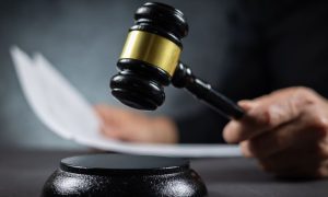 Judge's gavel resting near sentencing paperwork