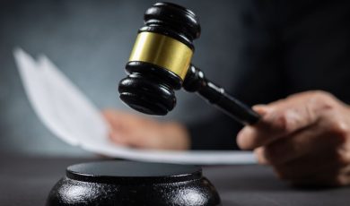 Judge's gavel resting near sentencing paperwork