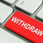 Red withdraw key on a computer keyboard