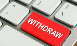 Red withdraw key on a computer keyboard