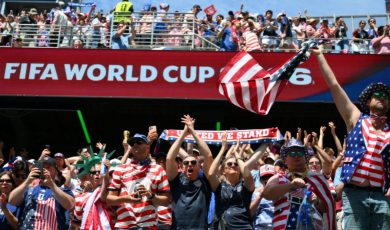 Fans in USA gear cheer at a FIFA World Cup match