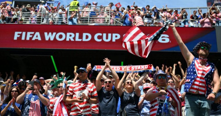 Fans in USA gear cheer at a FIFA World Cup match