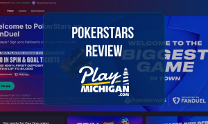 PokerStars Review: Online poker homepage featuring welcome bonus promotion, poker games, and Play Michigan review logo